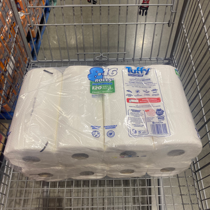 8 pack of paper towels wrapped in a plastic covering with brand name Tuffy Paper Towel back angle with materials and bar code written on it on a shopping cart for sale for costco online shopping. 